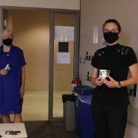 Krista Ash receives the Teacup Award from Dr. Fleischmann